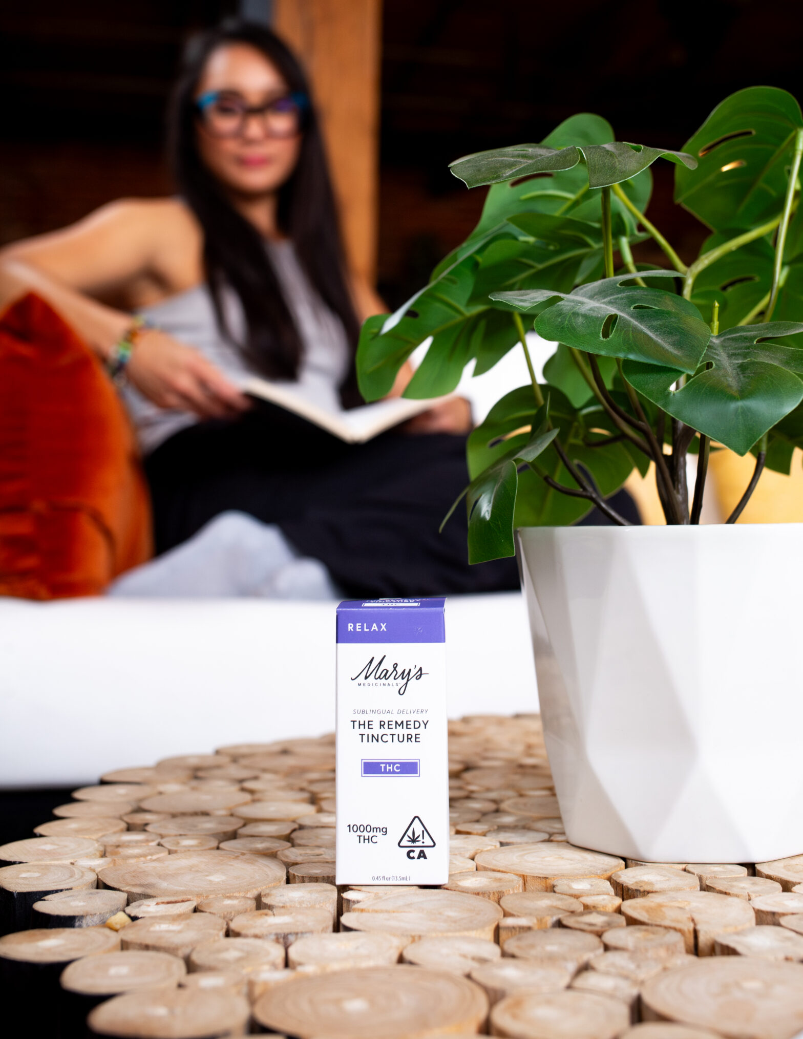 THC tincture on table with plant