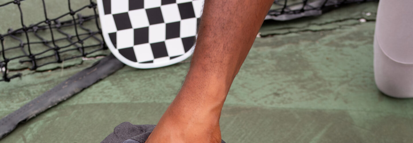 Person retrieving patch from black gym bag