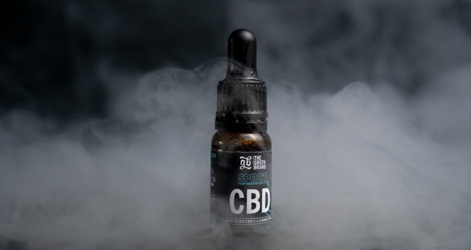 CBD oil bottle in smoky background