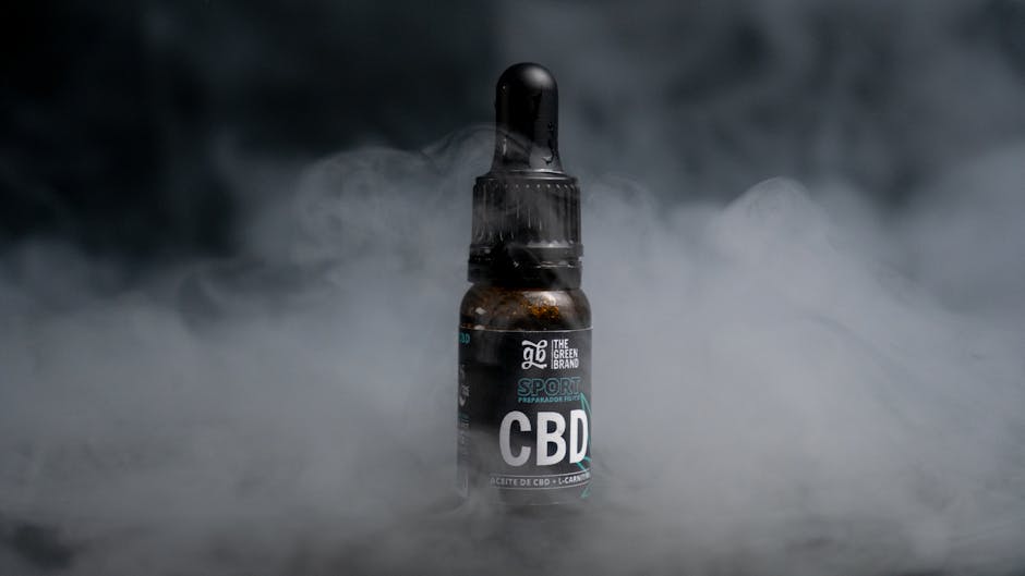 CBD oil bottle in smoky background