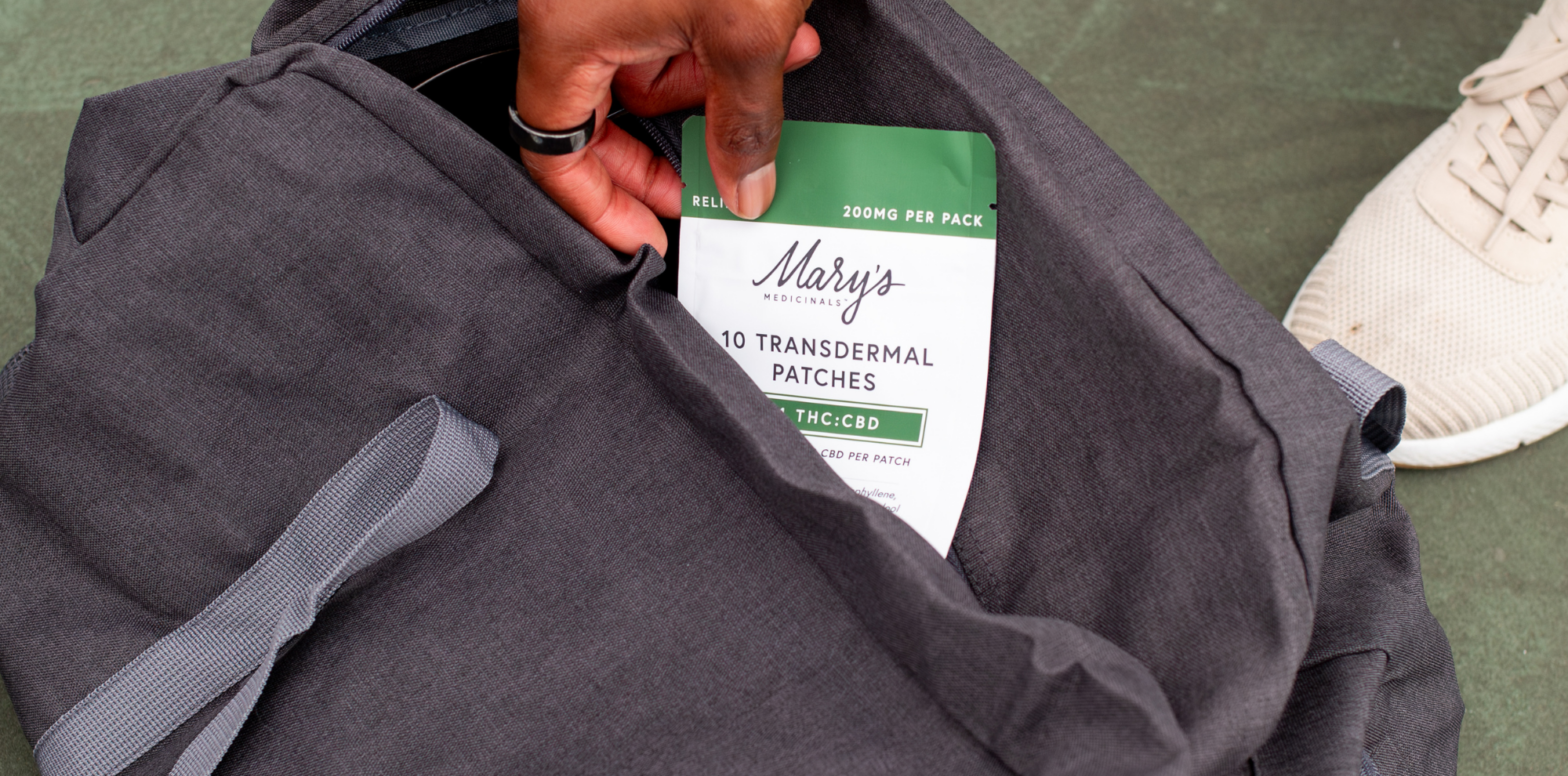man taking Relief 1:1 Transdermal Patch out of gym bag
