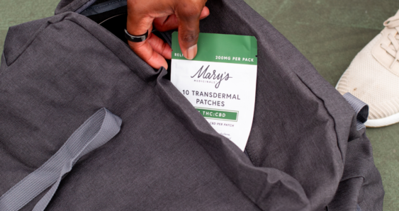 man taking Relief 1:1 Transdermal Patch out of gym bag