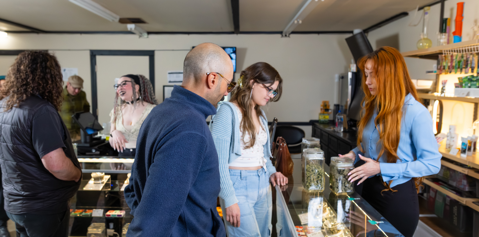 Customers exploring products at cannabis dispensary