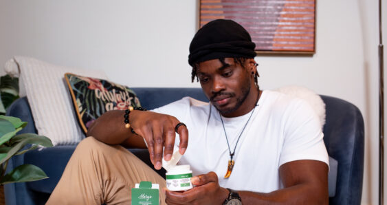 Man using topical cream for relief
