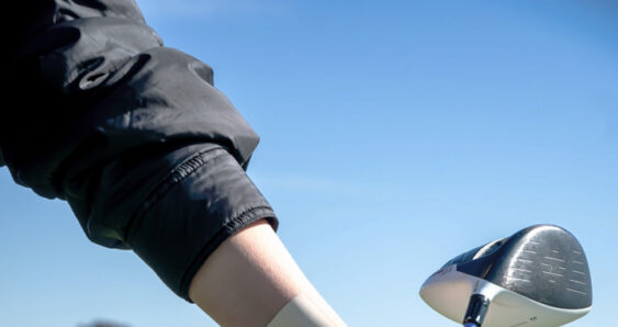 person playing golf with a relief 1:1 transdermal patch