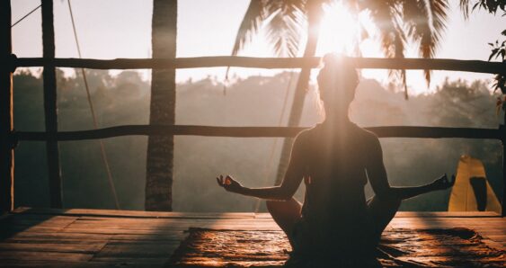 Sunrise yoga meditation outdoors tranquility
