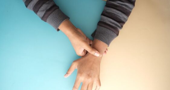 Person checking pulse on their wrist