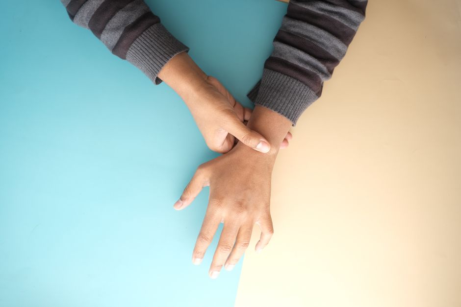 Person checking pulse on their wrist